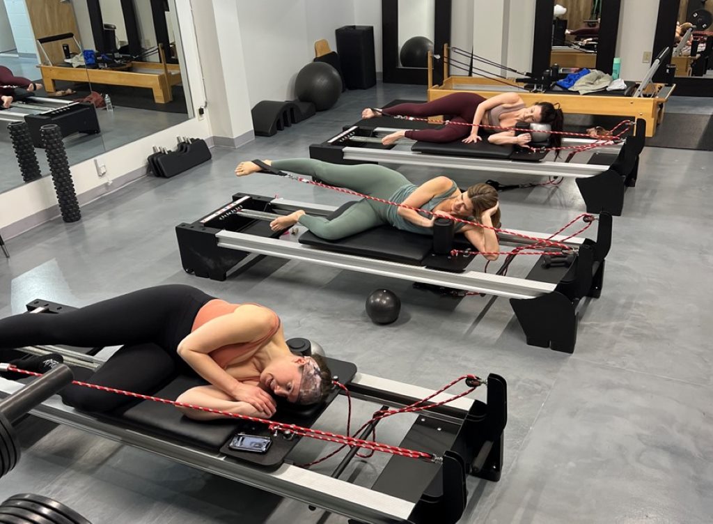 3 women doing Pilates workout